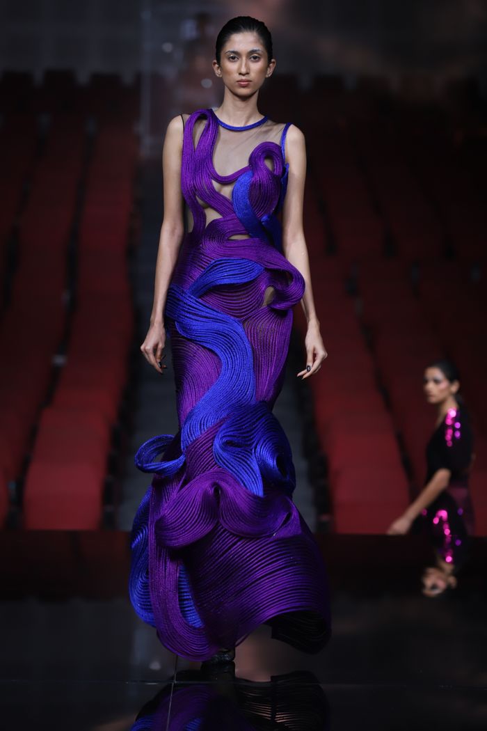 services-02 Elegant model showcasing a designer gown on the runway during a fashion show in New Delhi.